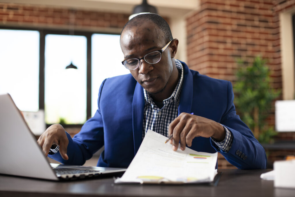 Black Man Reads Information On Clipboard - ADF PRO