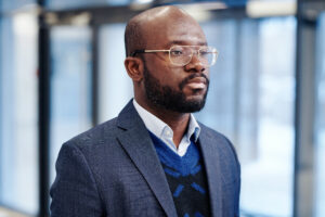 African Businessman Standing At Office - ADF PRO